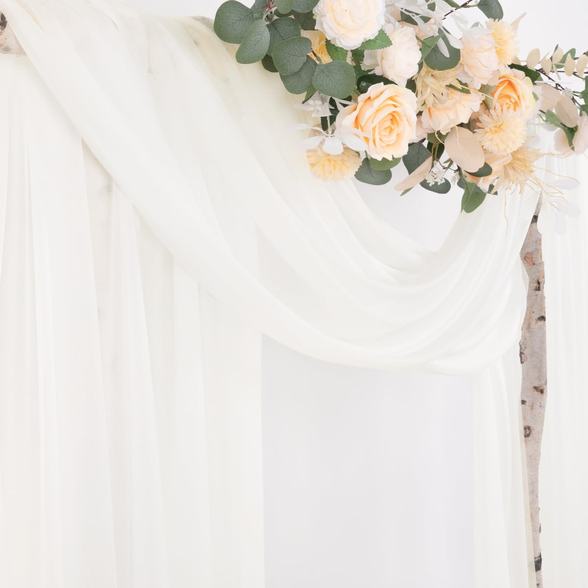 Socomi Ivory White backdrop fabric behind a photo area, enhances portraits with sheer glow.