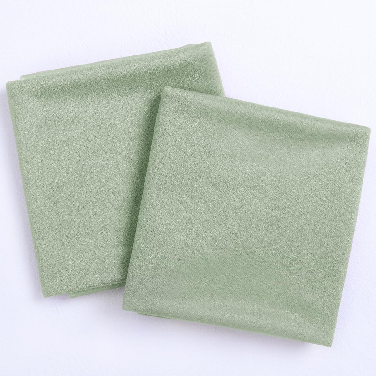 Socomi sage green arch drapes enhance arbor or chuppah with delicate folds