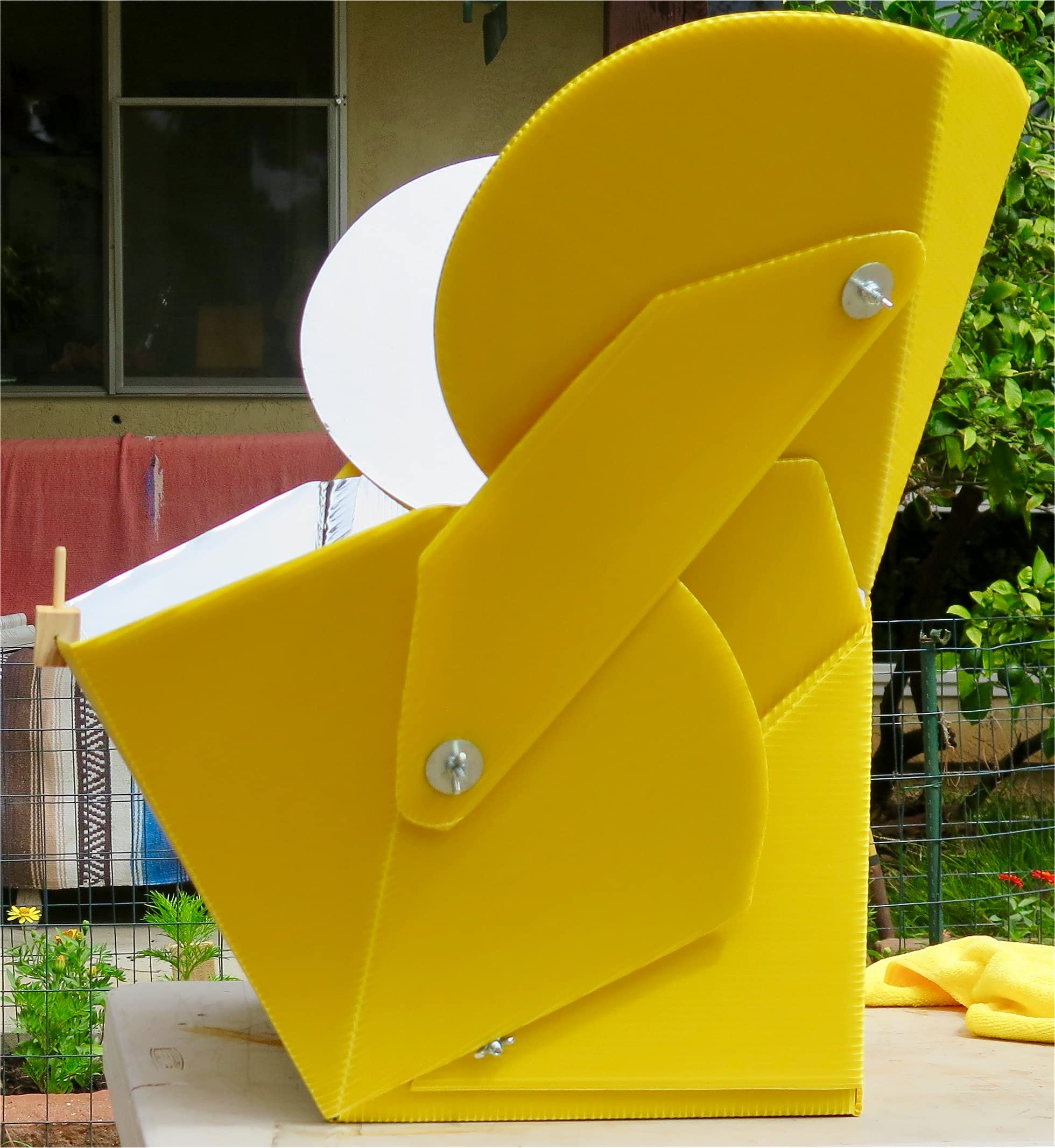 SOL COOK solar cooker with foldable frame for quick setup.