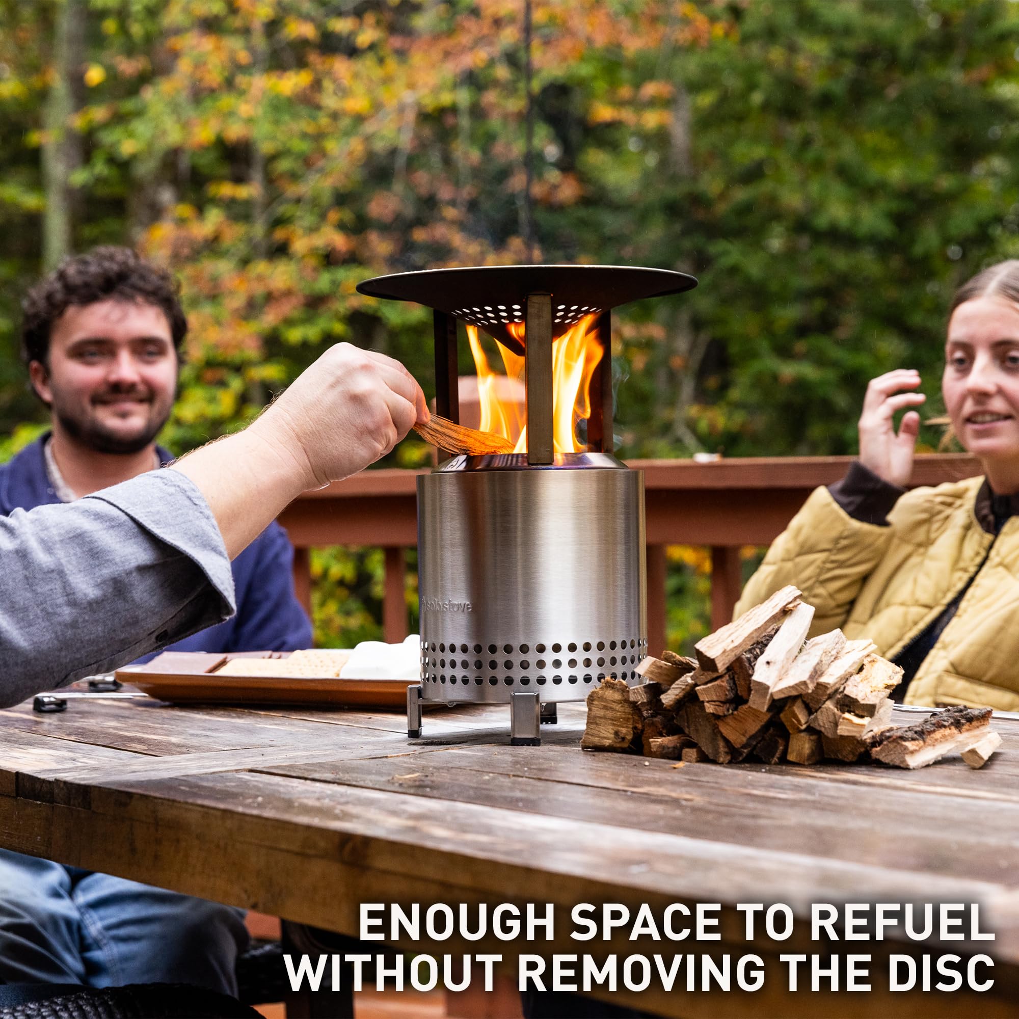 Solo Stove Mesa XL heat deflector on fire pit redirects warmth toward seating.