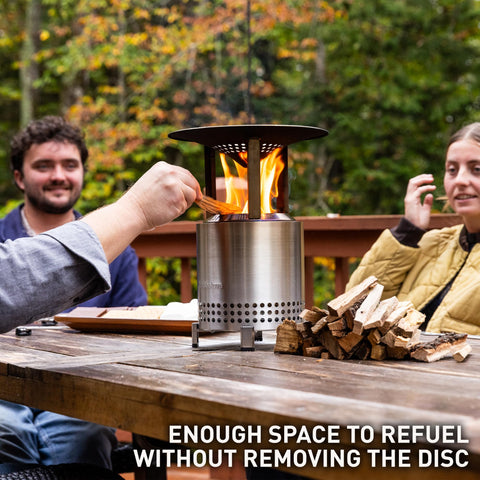 Solo Stove Mesa XL heat deflector on fire pit redirects warmth toward seating.