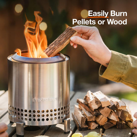 Wood-burning flames visible in the compact Mesa XL on a patio.