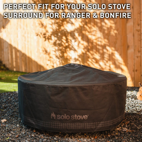 Side view of Shelter Small demonstrating snug fit around a compact fire pit surround.