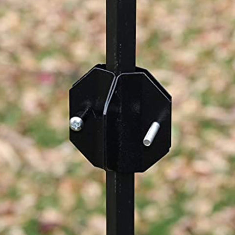 Songbird Essentials Squirrel Defeater baffle with stabilizer resting above ground.