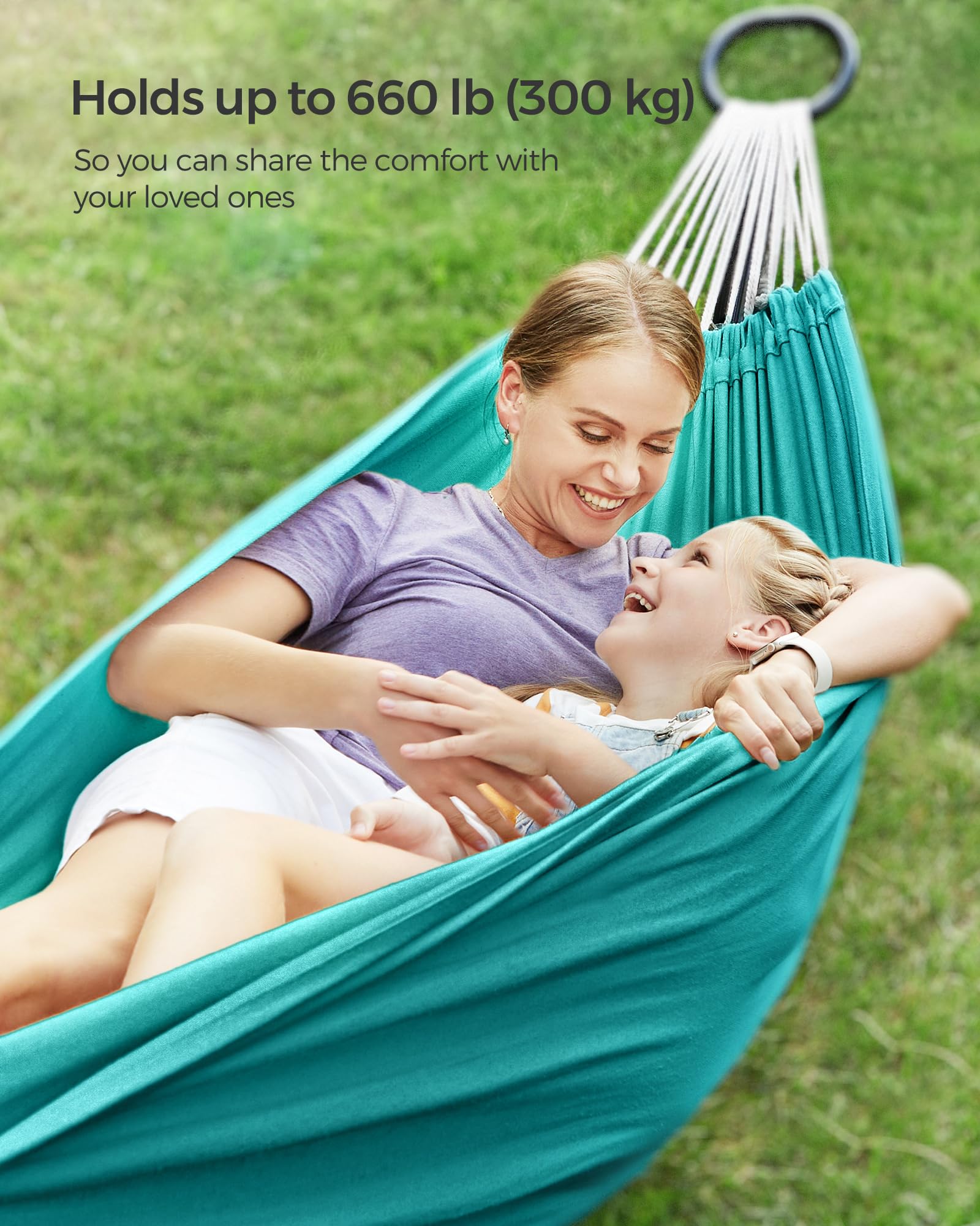 Turquoise Songmics hammock between trees on a terrace for relaxing outdoor comfort