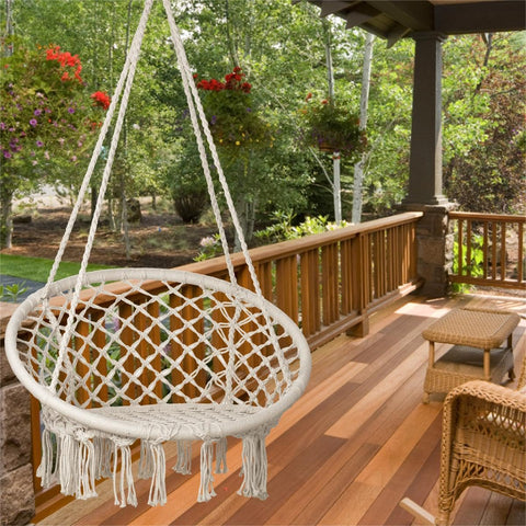 Sonyabecca LED macrame hammock chair in a cozy bedroom reading nook.