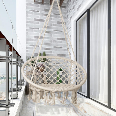 Sonyabecca hammock chair on patio at dusk with warm glow.