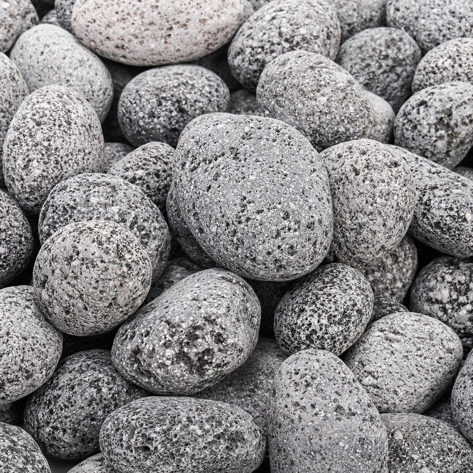 Lava rocks showing heat dispersion setup around a fire pit by SOUJOY.