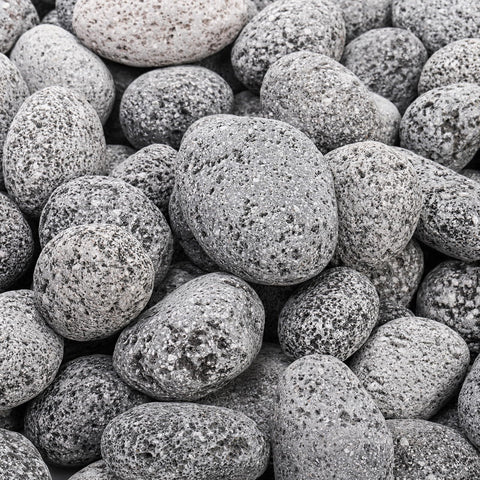 Lava rocks showing heat dispersion setup around a fire pit by SOUJOY.