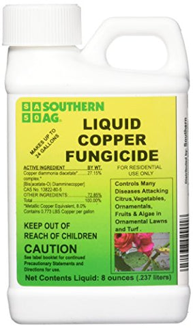 Southern Ag Liquid Copper Fungicide applied to live oaks for moss control.