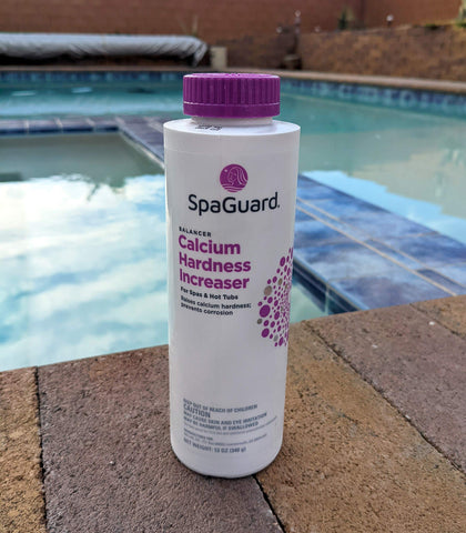SpaGuard Spa Calcium Hardness Increaser pour demonstrates easy dosing for maintaining spa calcium levels.