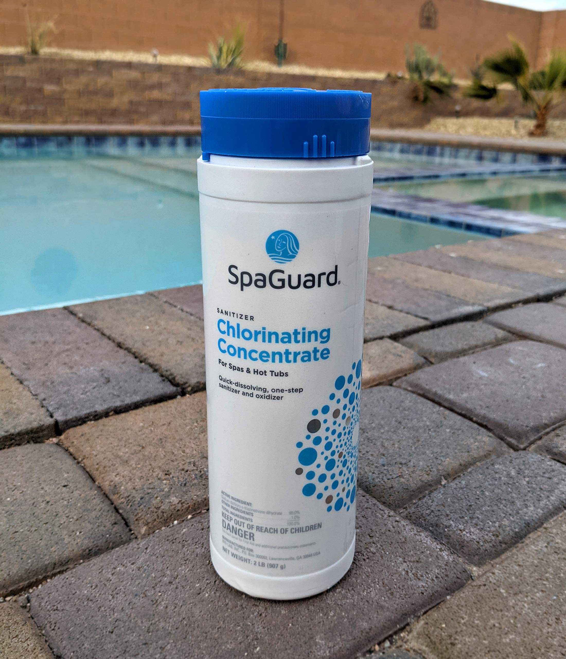 SpaGuard Chlorinating Concentrate dissolving in water to maintain balanced spa sanitation.