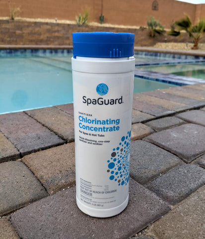 SpaGuard Chlorinating Concentrate dissolving in water to maintain balanced spa sanitation.