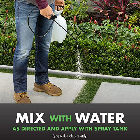 Sprayer applying Spectracide Triazicide for even lawn coverage