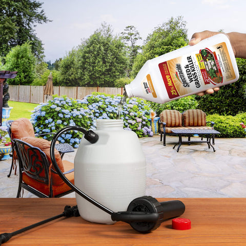 Spectracide Weed Killer Concentrate 40oz being applied on patio to target weeds.