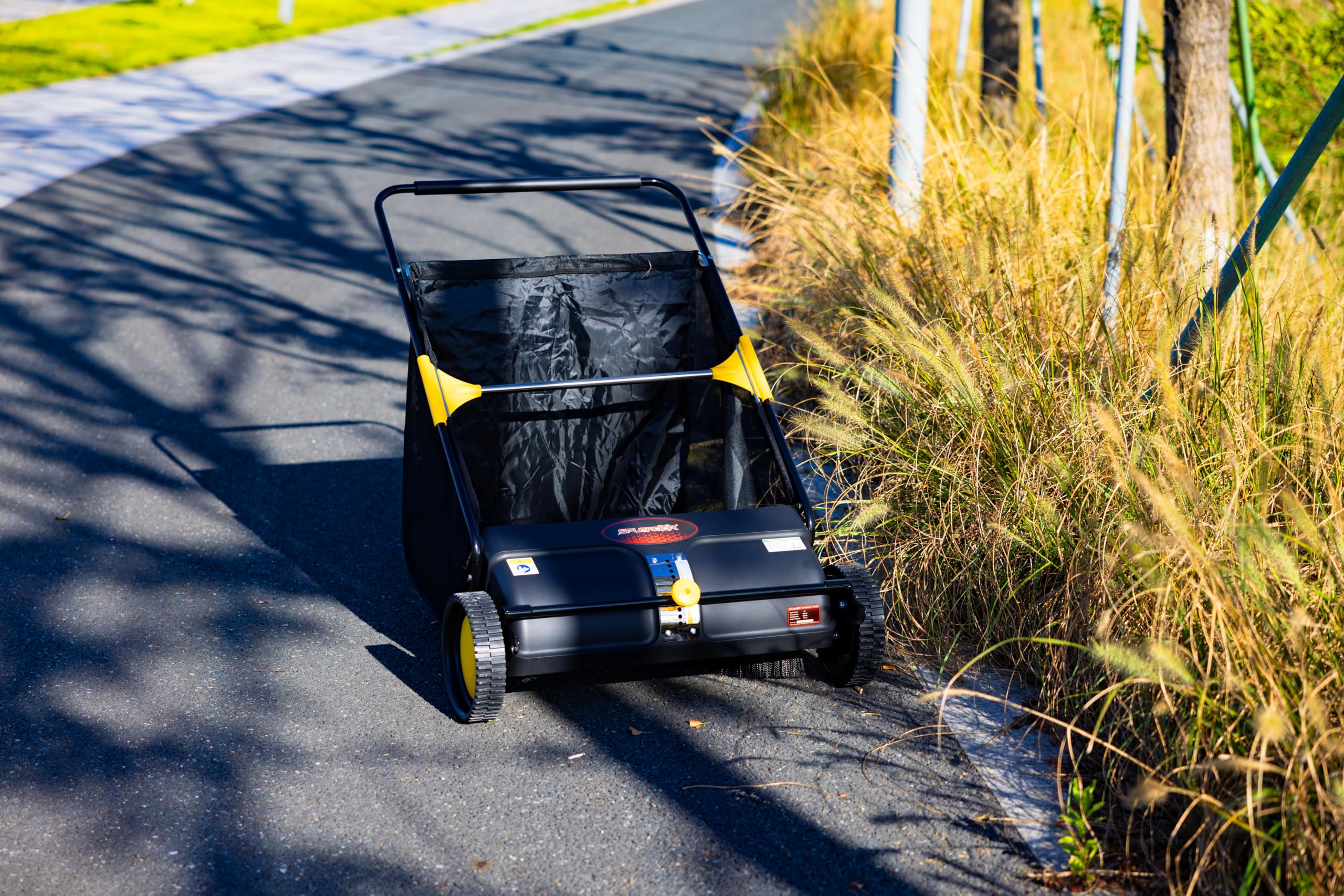 SPLENDOR LS-650A2 in action sweeping leaves along a driveway with effortless maneuverability