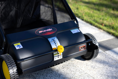 SPLENDOR lawn sweeper with adjustable height capturing grass clippings on a sunny patio