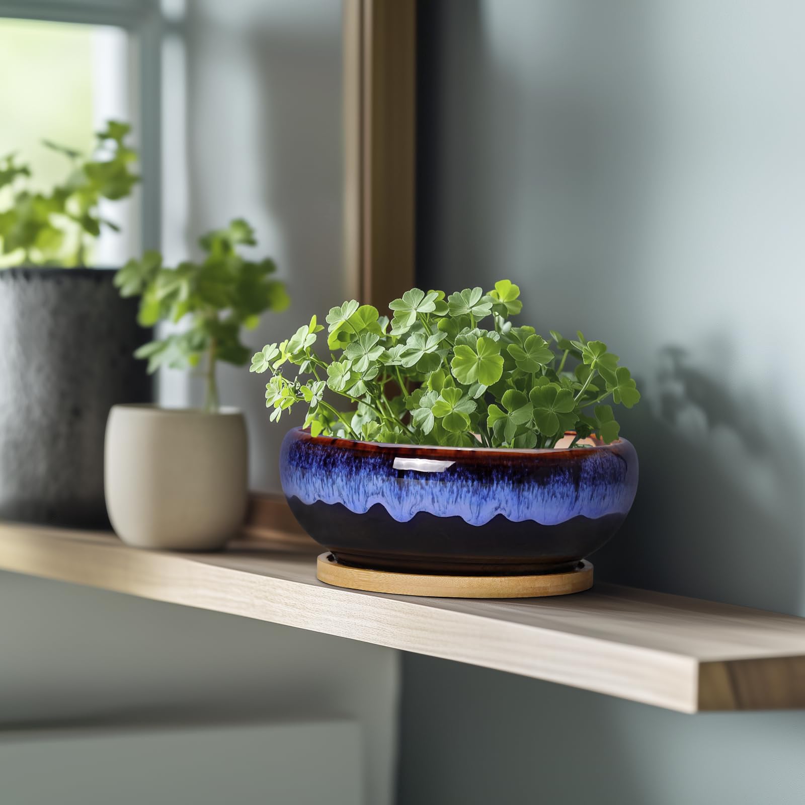 SQOWL glazed ceramic finish pots add vintage rustic charm to shelves.