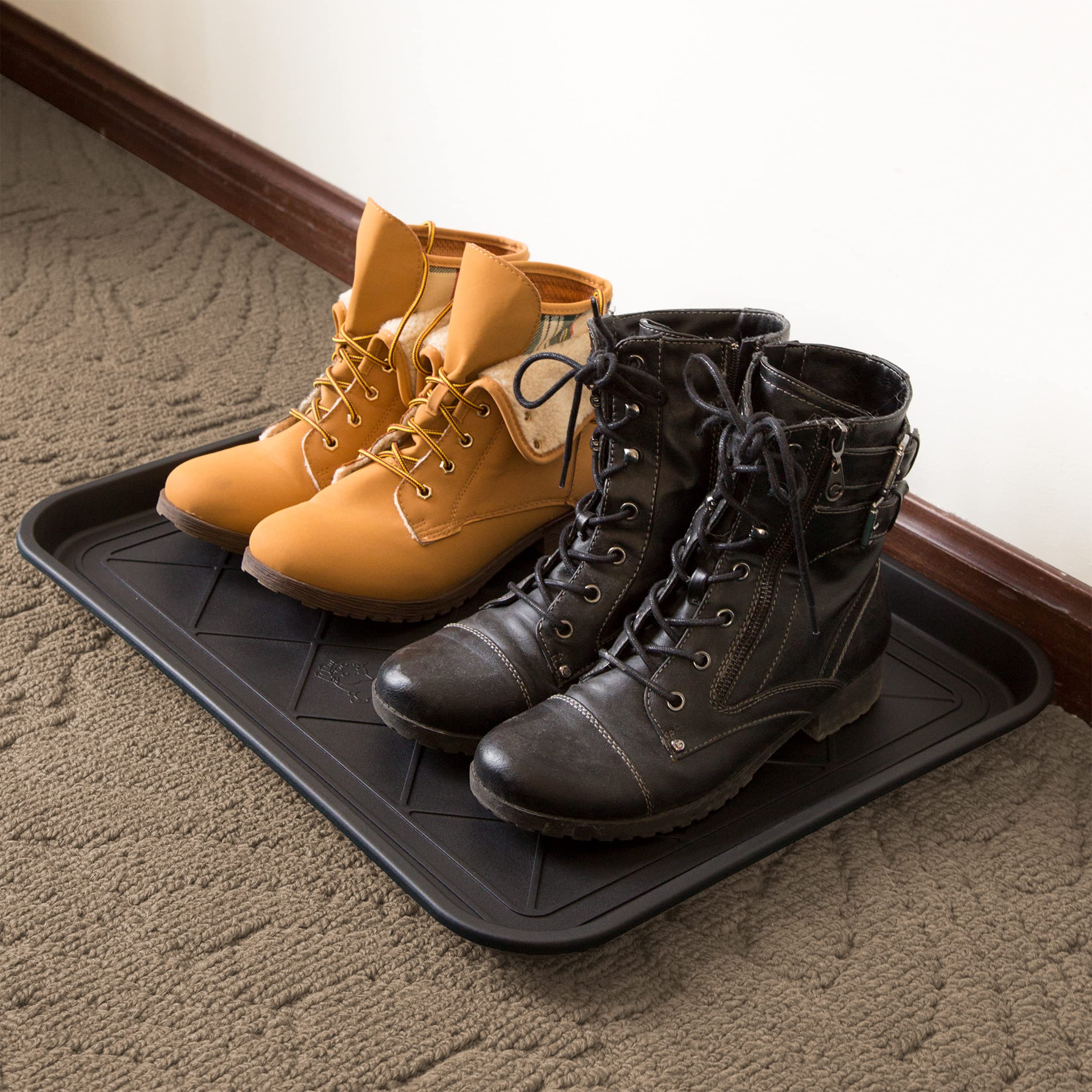 Stalwart boot tray in entryway keeping mud off hardwood floors