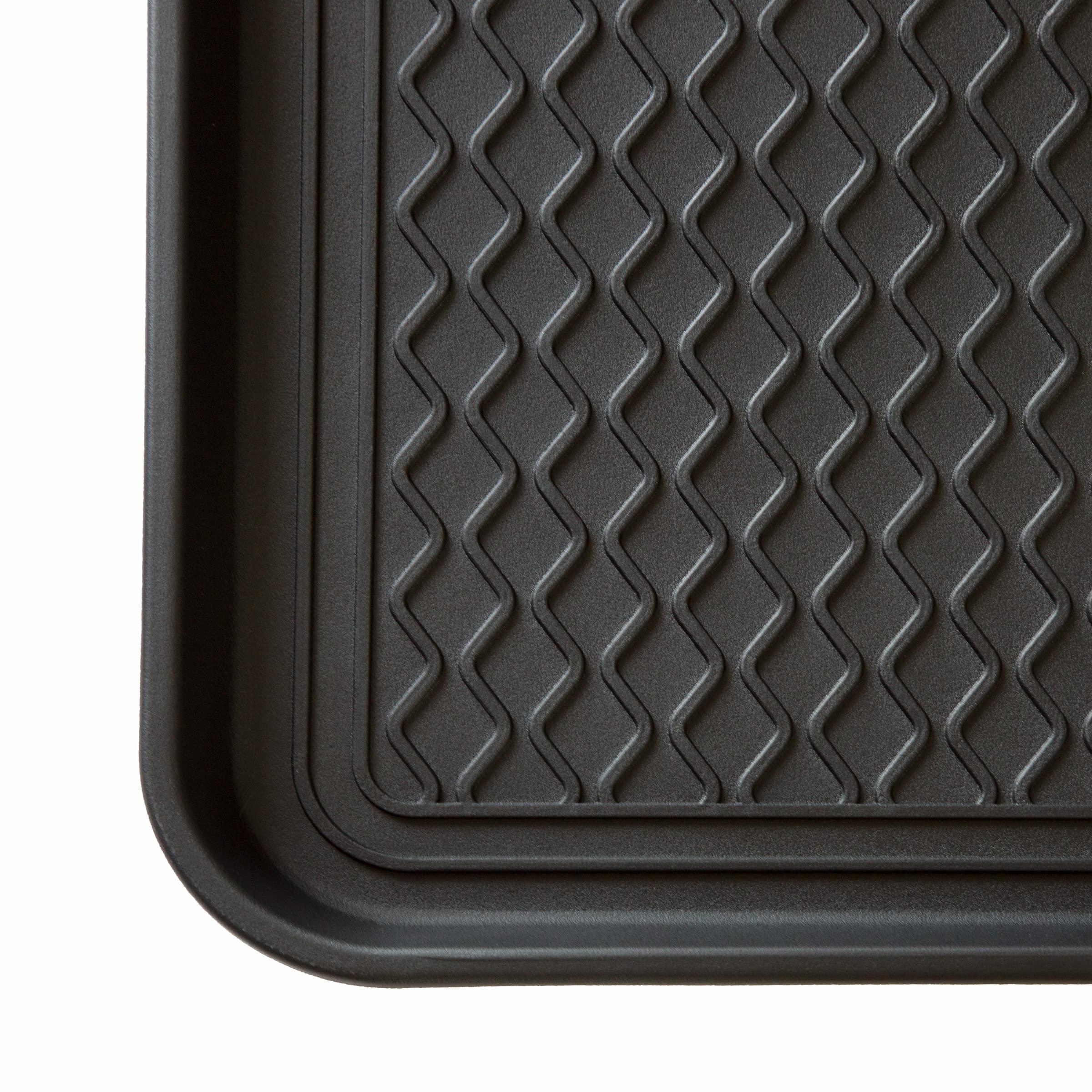 Stalwart boot tray in black blends with decor while protecting floors.