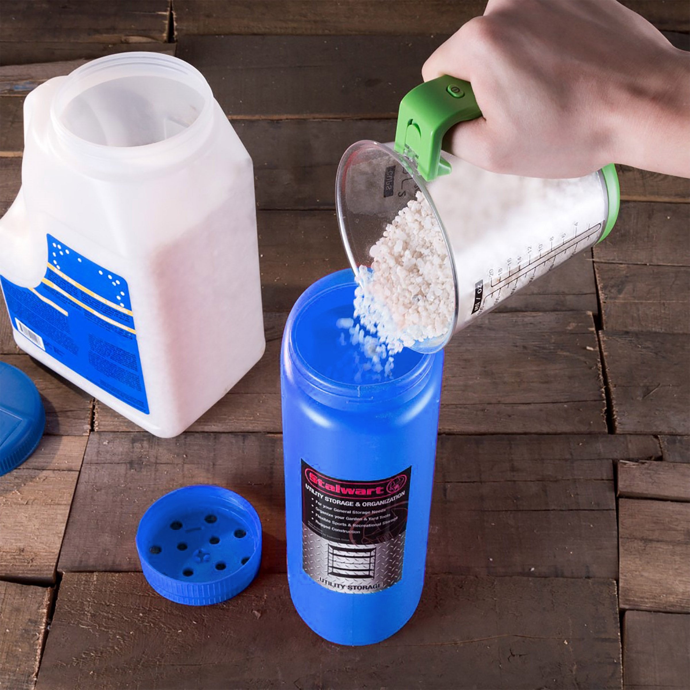 Stalwart salt-seed-spreader blue holds 2-3 liters, reducing refills during large yard jobs.