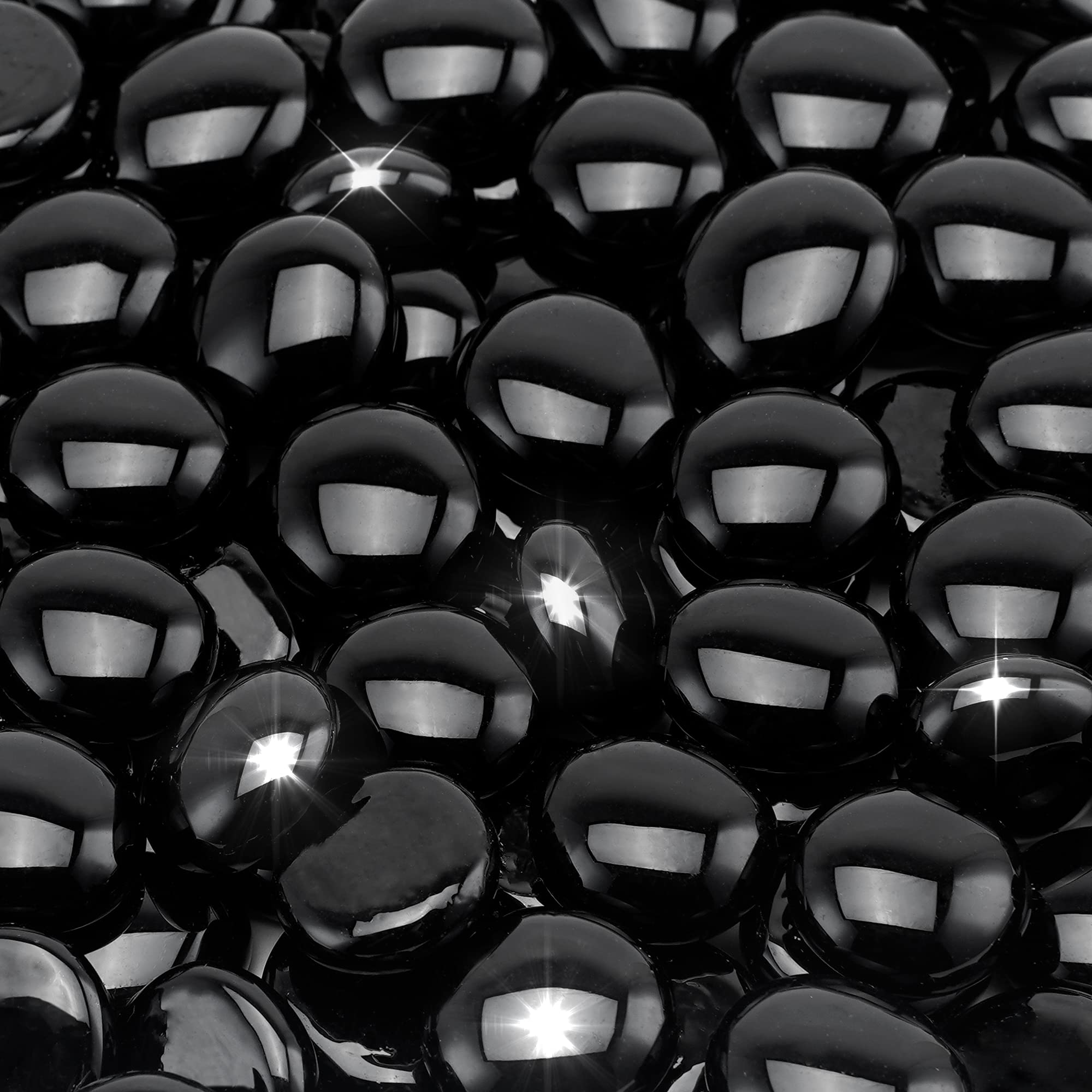 Stanbroil onyx black luster fire glass drops in a fireplace create shimmering glow