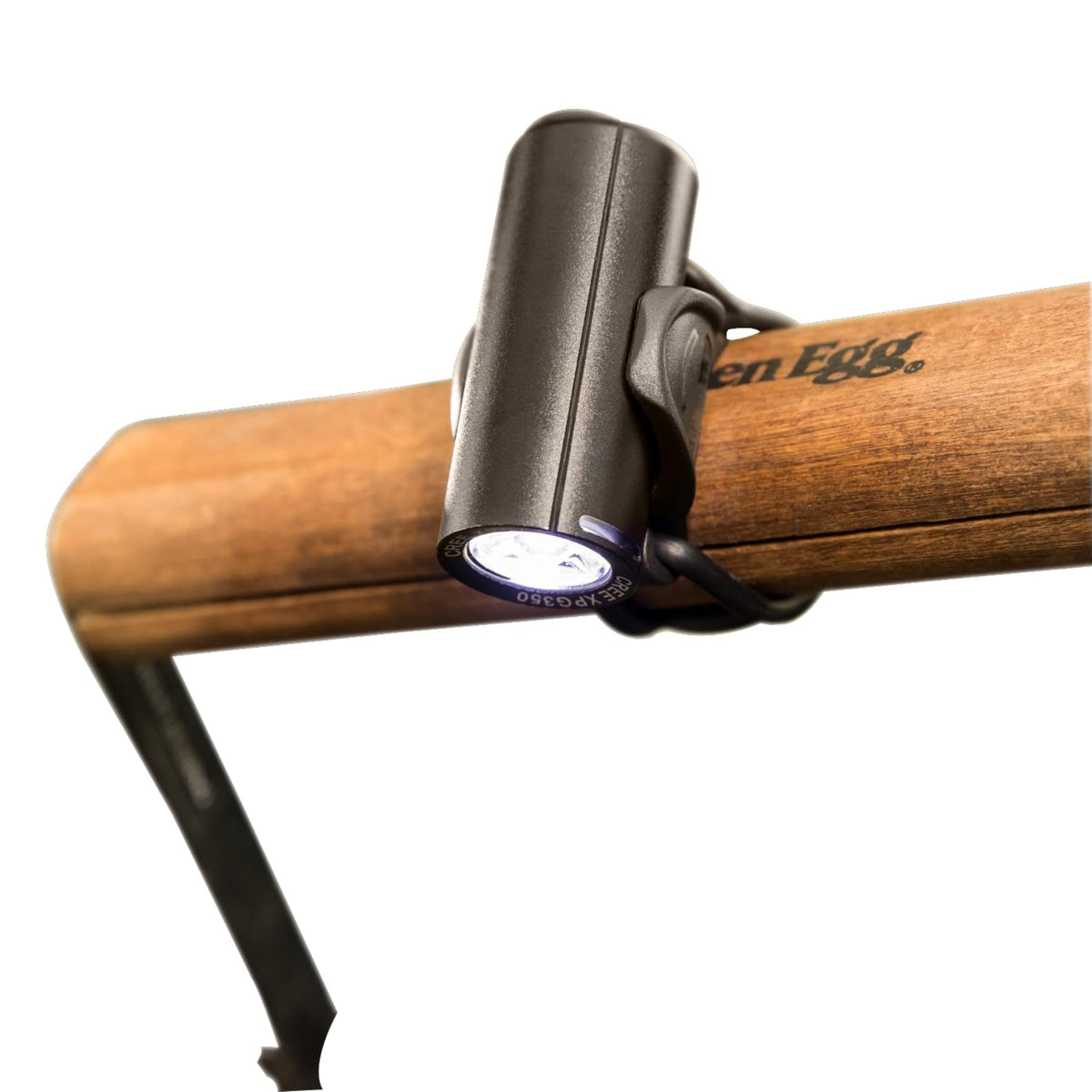 StarBright Grill Light attached to the Big Green Egg handle for clear nighttime cooking
