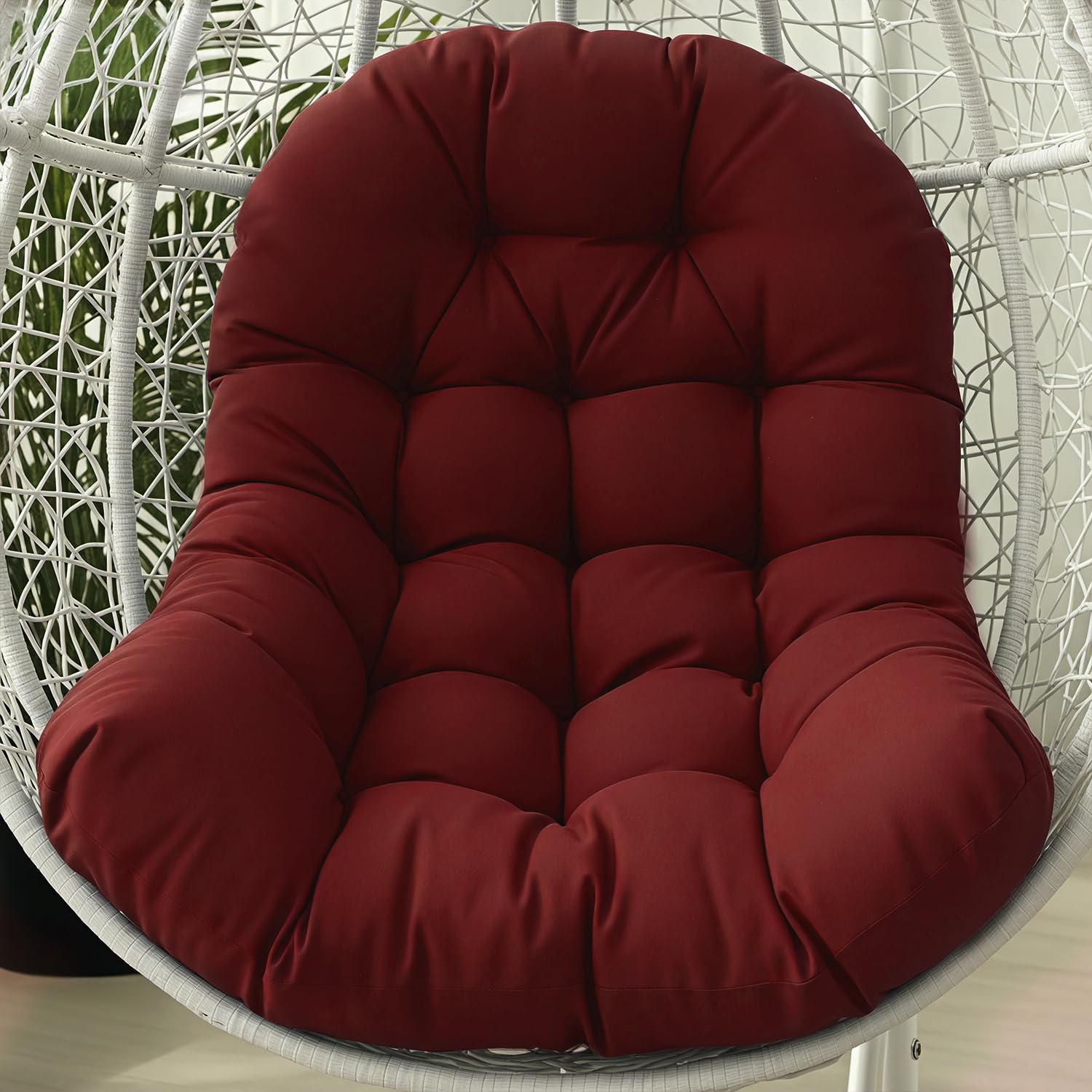 STAYDEN Egg Chair Cushion wine red on patio for lounging
