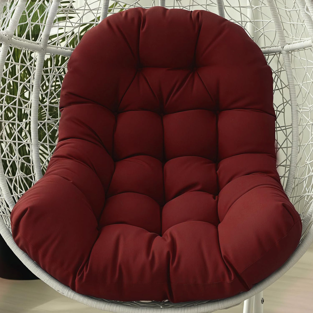 STAYDEN Egg Chair Cushion wine red on patio for lounging
