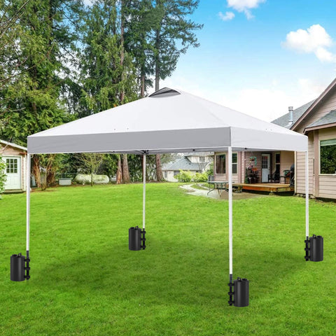 Stdserendi four-pack canopy weights arranged for beach or event use
