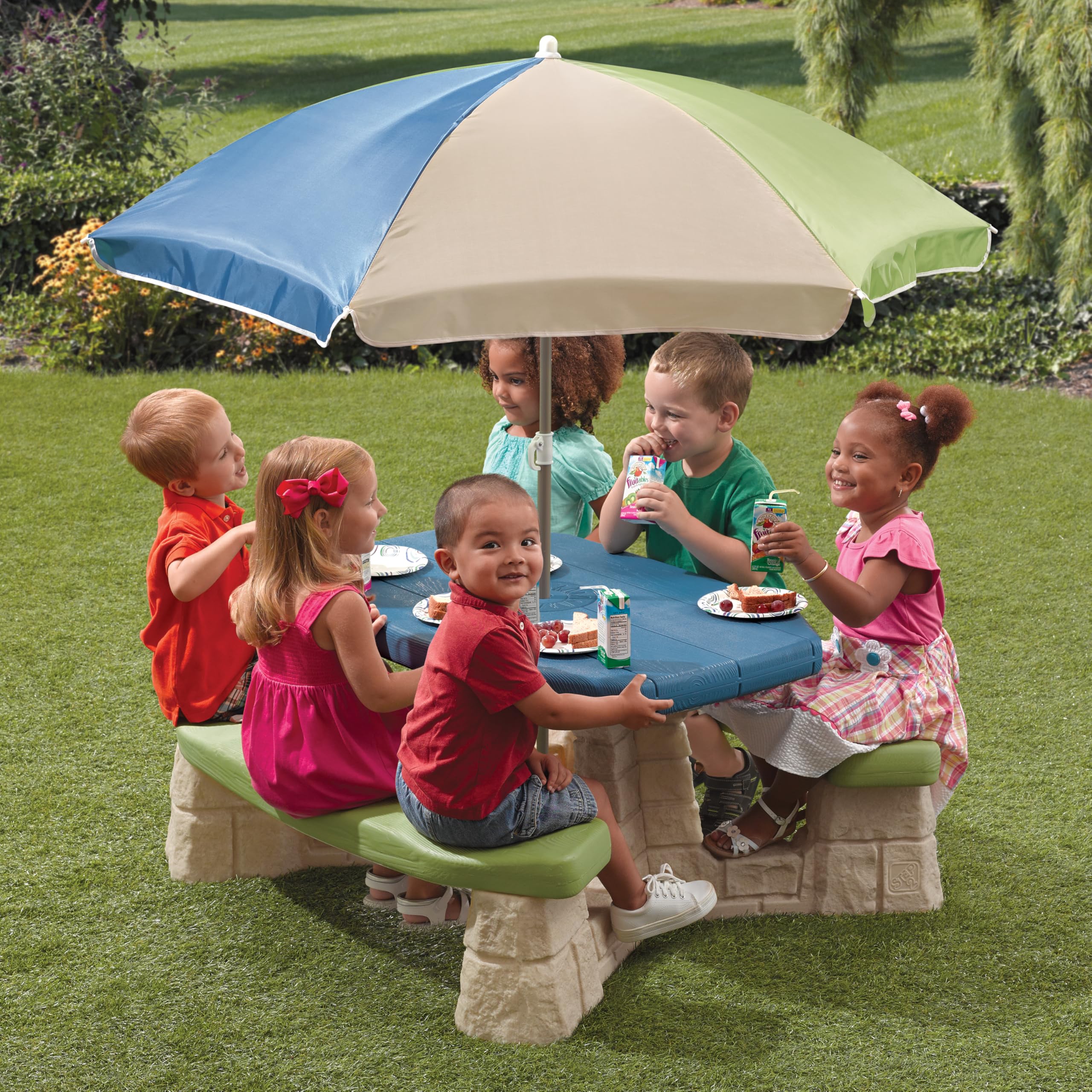 Step2 picnic table features a sandstone-style tabletop for versatile indoor or outdoor play.