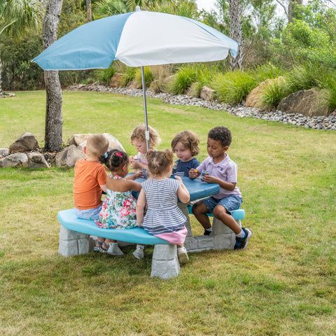 Step2 Sun & Fun Picnic Table in sandstone color blends with decor.
