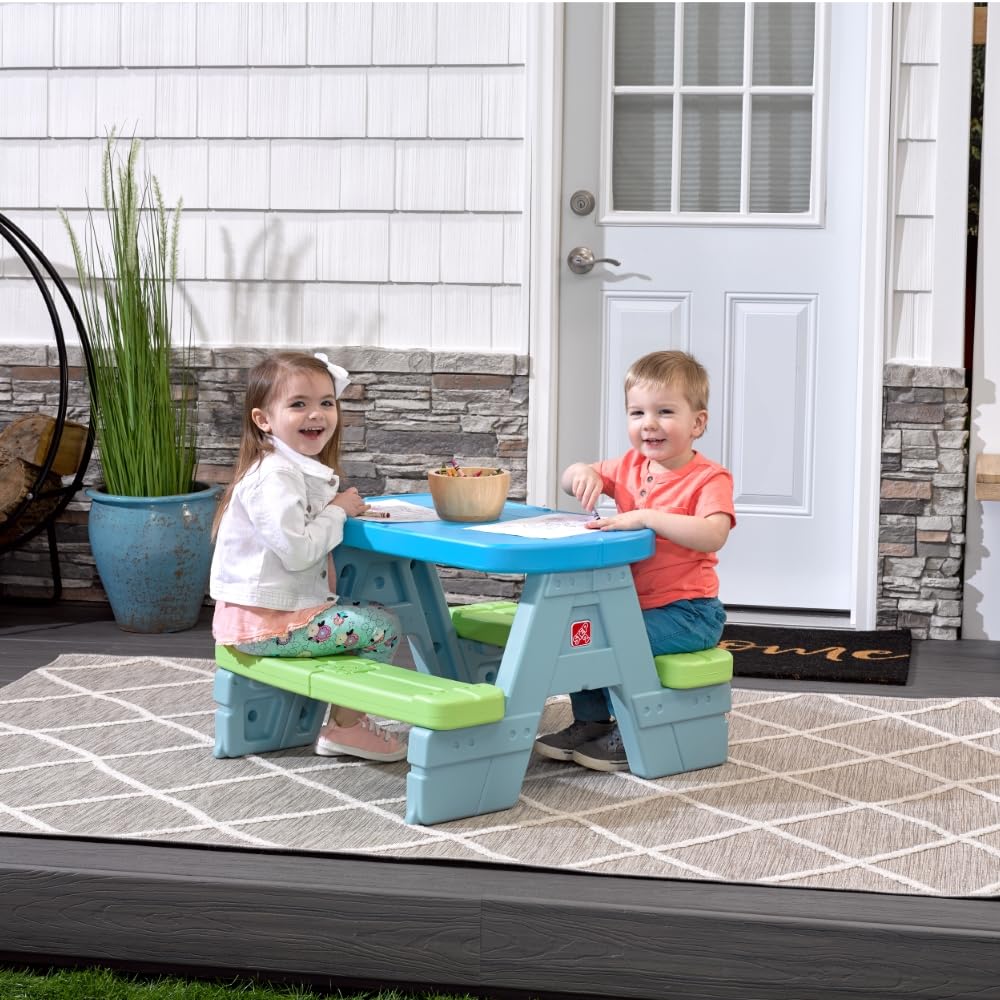 Step2 Sun & Shade outdoor picnic table shown in sunny backyard