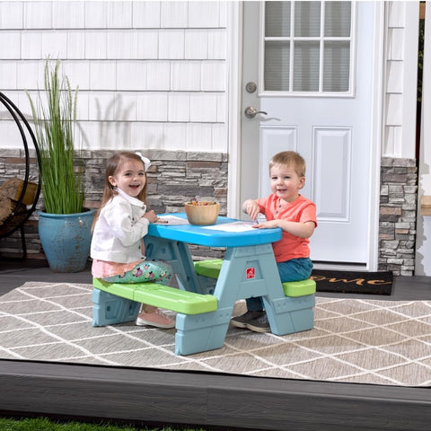 Step2 Sun & Shade outdoor picnic table shown in sunny backyard