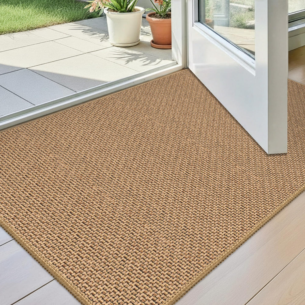 StepAura front view beige mat with low-profile fit under doors.