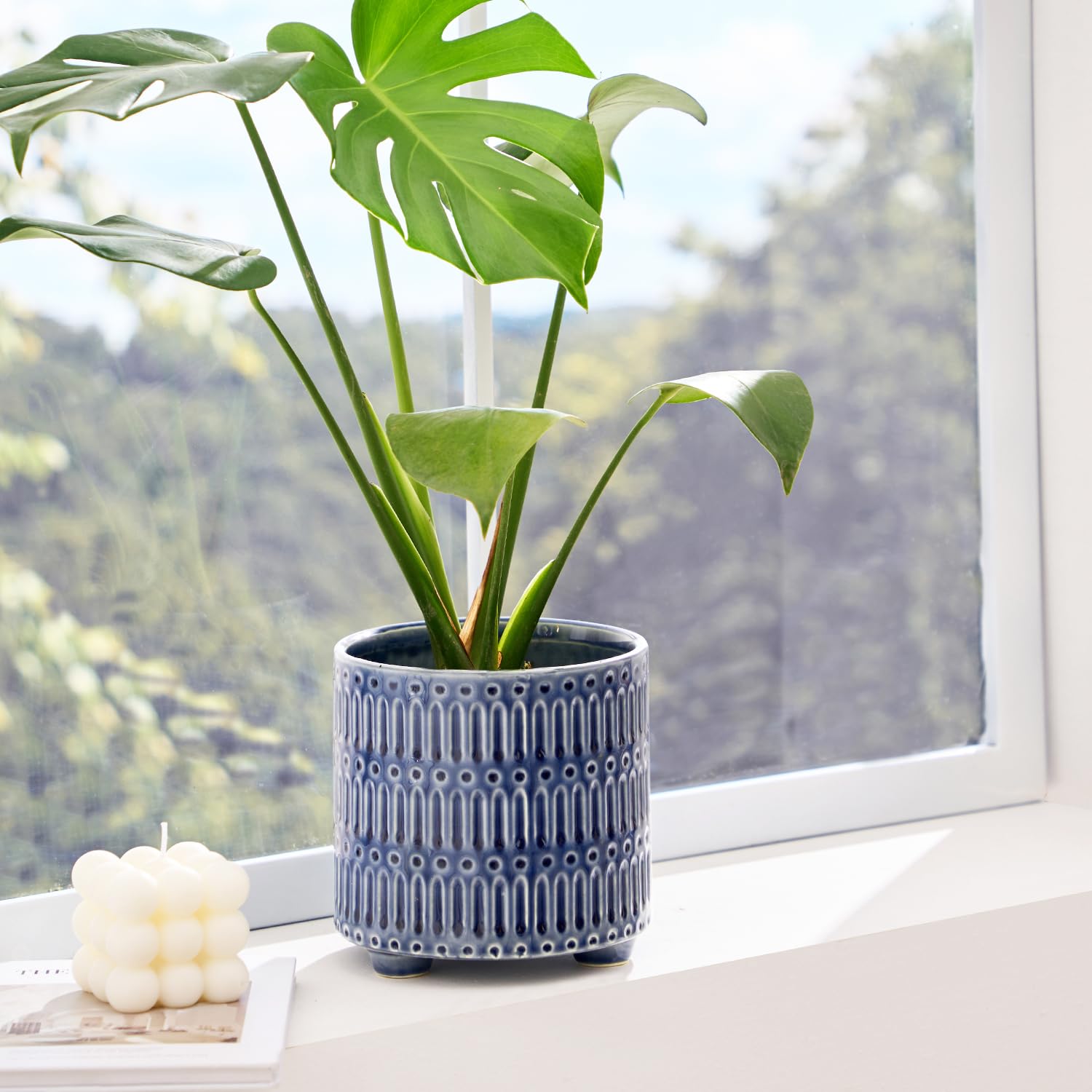 STHIE blue round ceramic planter demonstrates sturdy build for healthy indoor plants.