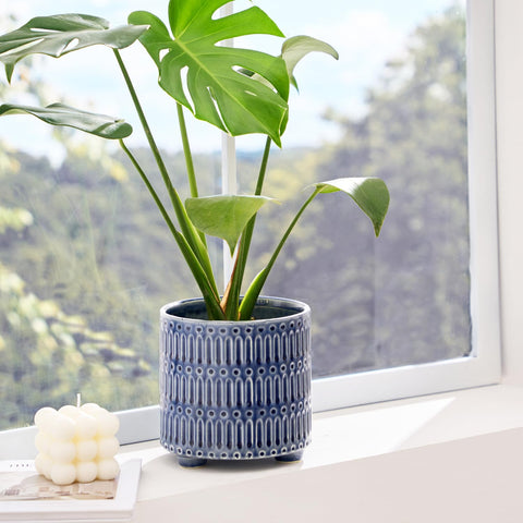 STHIE blue round ceramic planter demonstrates sturdy build for healthy indoor plants.