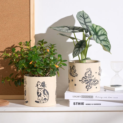 STHIE crackle glaze cat planter adds unique texture and charm.