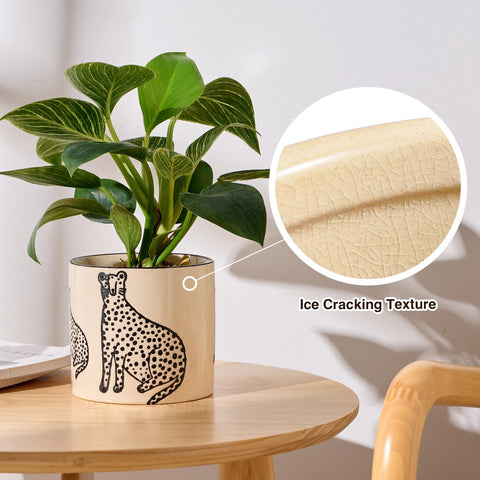 Round ceramic planter featuring panther design for decorative home accents.