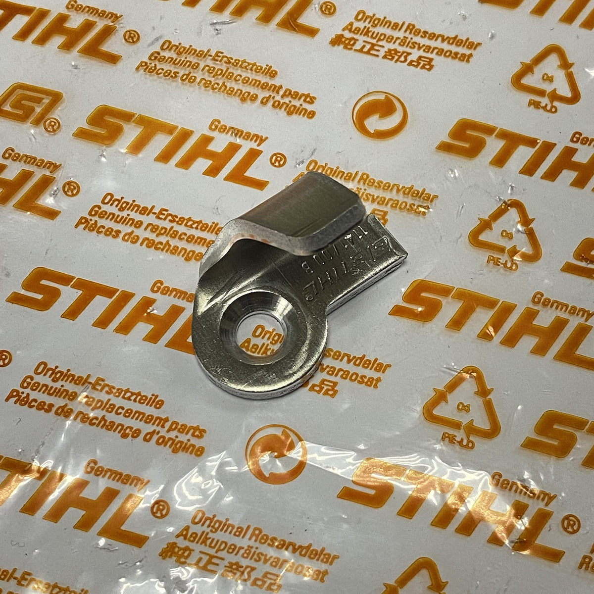 Stihl OEM chain catcher close-up showing rugged metal construction for MS series