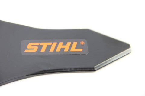 Stihl metal blade in use on a brushcutter for dense vegetation