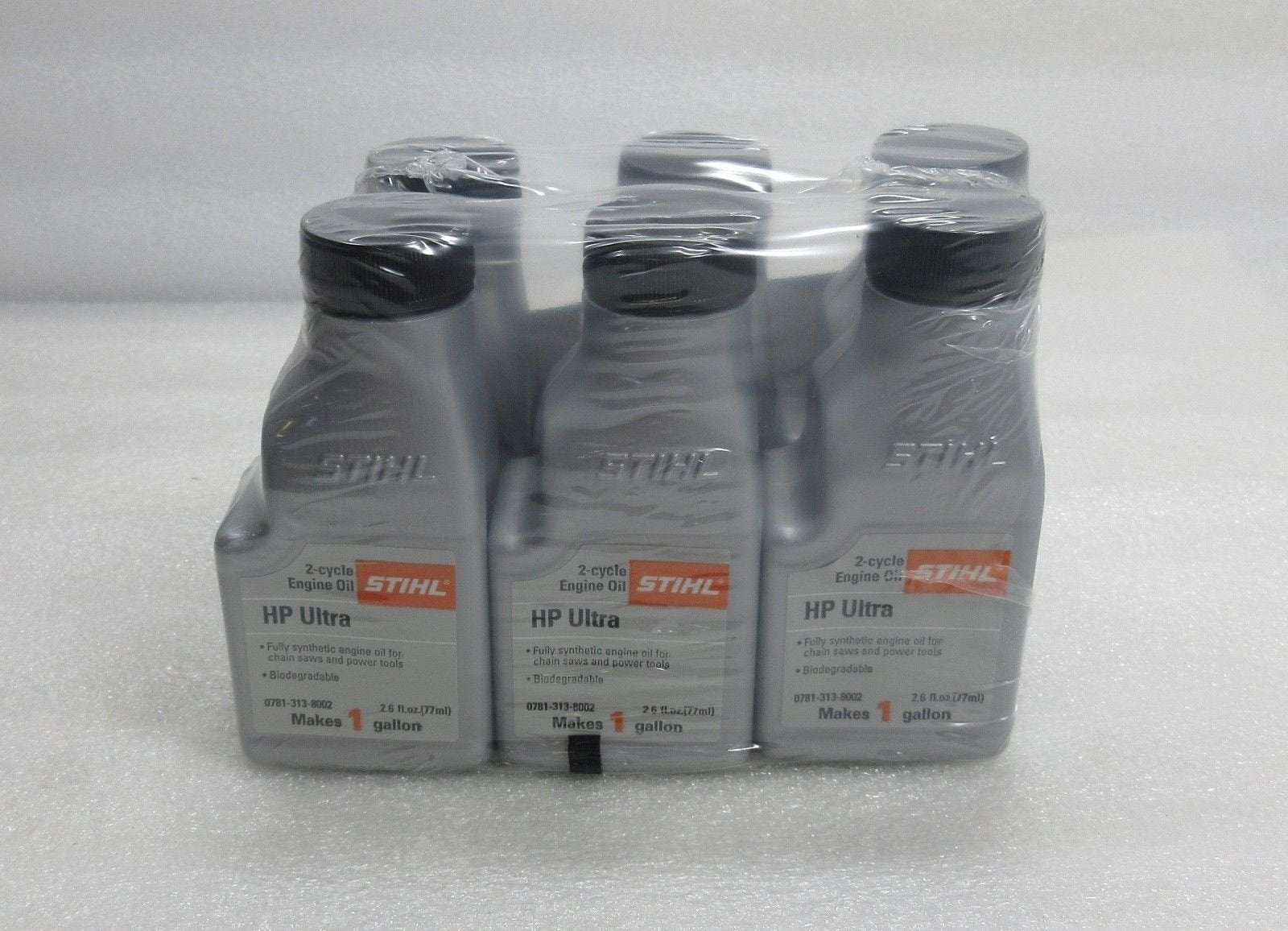Stihl oil mix 1-gallon bottle, six-pack, for high-performance 2-cycle engines.