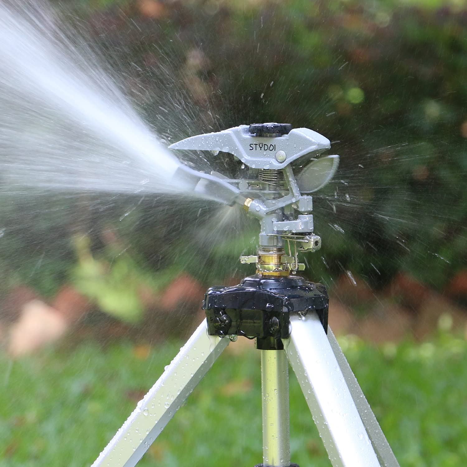 STYDDI tripod sprinkler side adjustment demonstrates height flexibility for precise irrigation