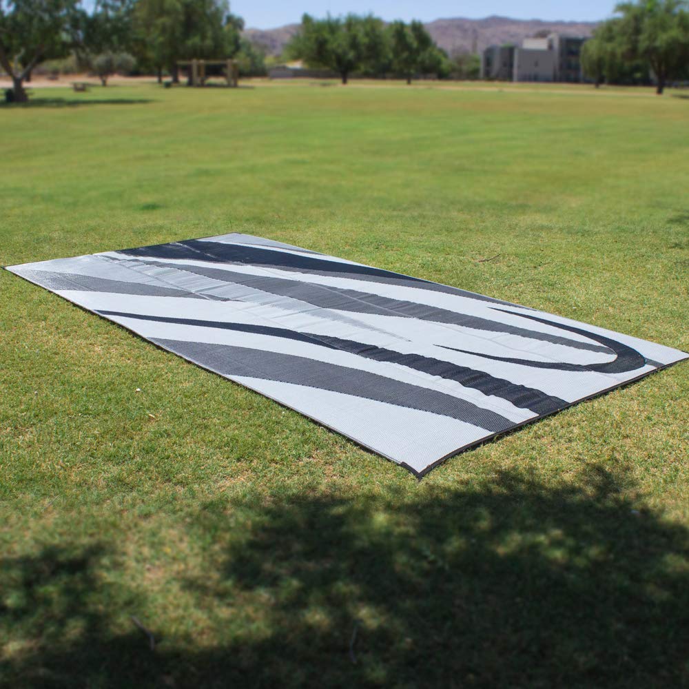 Stylish Camping GA1 mat laid on grass, protecting turf and providing a clean surface.