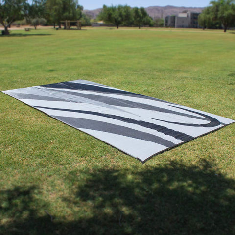 Stylish Camping GA1 mat laid on grass, protecting turf and providing a clean surface.
