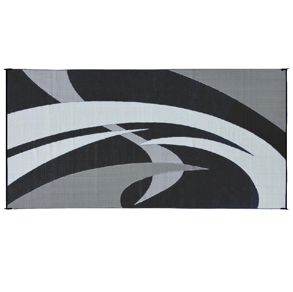 Stylish Camping reversible mat laid out for a picnic under trees.