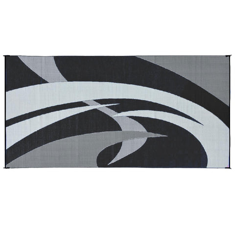 Stylish Camping reversible mat laid out for a picnic under trees.