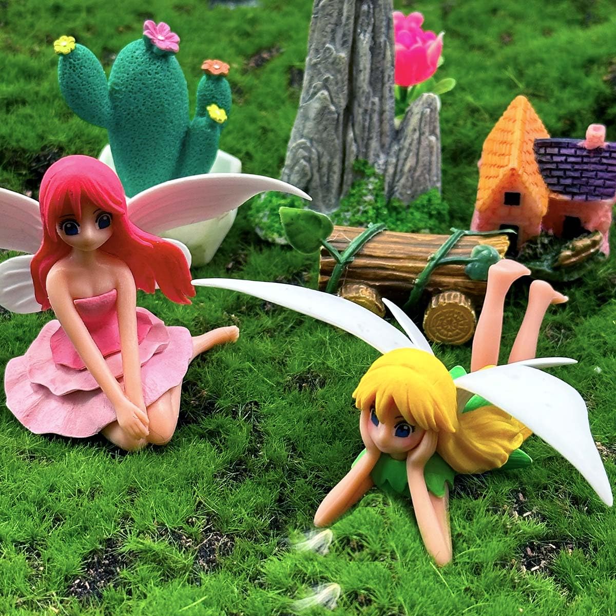 Suartus mini garden setup showcasing the four-piece fairy set in a decorative display.