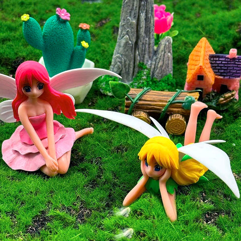Suartus mini garden setup showcasing the four-piece fairy set in a decorative display.