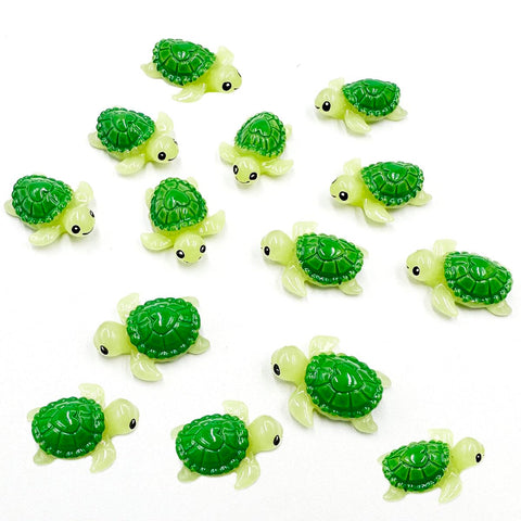 Suartus mini green turtle figurines in a fairy garden display.